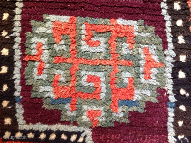 Tibetan Warp-faced back ( wang-den ) saddle carpet. 
Late 19th Century.
Excellent burgundy colour.
26 x 51 inches                 