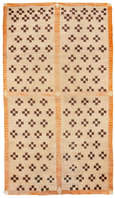  Tibetan Door carpet. This interesting example features an atypical composition of stepped crosses in the four quadrants. With uniformly low pile, this piece has the wear that one would expect from  ...