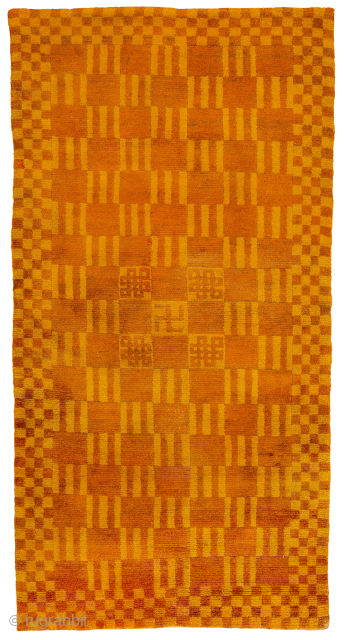 Checkerboard sleeping carpet. An interesting composition with alternating squares and bars forming the central geometric field and smaller checked border. With 4 eternal knots flanking a central swastika and the golden dyes,  ...
