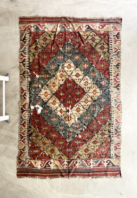 A Central Anatolian kilim with beautiful natural dyes, l first half  19th century. 184 x 117 cm.
The brown wool shows typical age-related corrosion, particularly within the central field around the Elibelinde?  ...