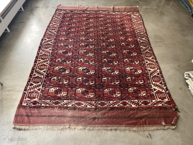 A Kyzil Ayak main carpet with a large border.  Loges dates the carpet to about 1850. The condition is good, it still has a pile except for a lower area in  ...