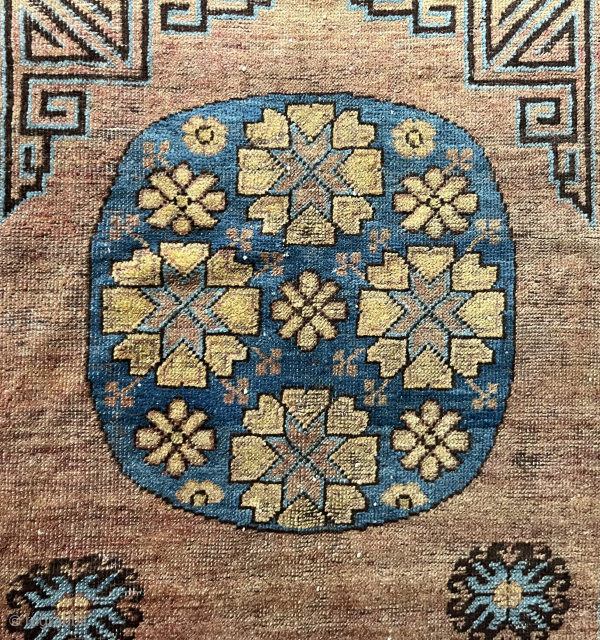 This fragment of a Khotan carpet actually shows half of a carpet and features a magnificent, beautifully drawn medallion. The carpet is in good condition, with an original ending and no restorations.  ...