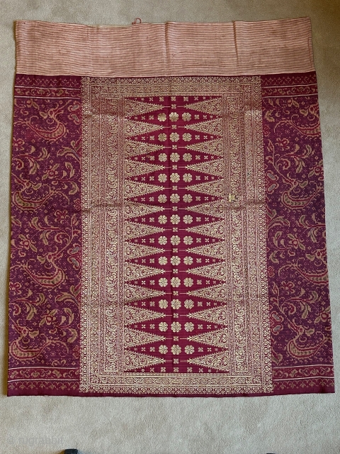 Fine sarong with stylised naga. Bangka, Sumatra, Indonesia. Silk weft-resist dyed, gold metal threads, cotton. Size:104 x 88cm. Around 1900. Item: BLS68. www.tinatabone.com          