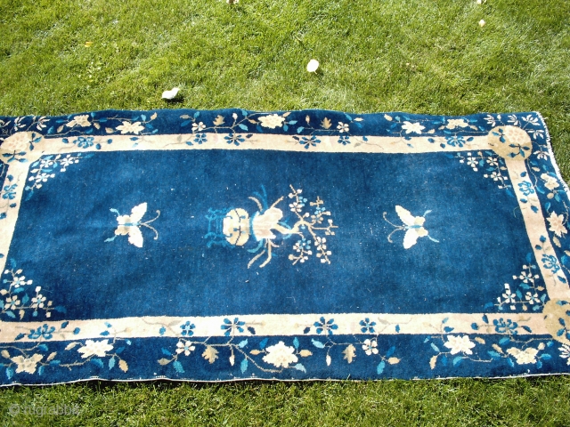 A good, honest pre-WW2 Chinese rug about 3x5 (36 by 66 inches), medium to low pile all over, dirty, end erosion but not into the pattern. The typical (meaning real) blue and  ...