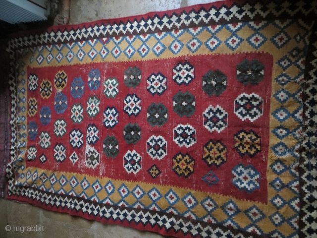 Qashquai kelim, 19th century, 5 ft x 9 ft 4 in, Shows wear, and some holes , but highly decorative. Rd ground ones were supposedly wedding pieces. More detailed pictures on request. 