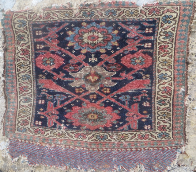   SOLD: Northwest Persian bagface with unusual field design, 19th century, good soft colors. 25x 22 inches.
Visible edge wear and very tiny hole at 8 o'clock.      