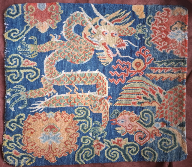 Tibetan Khagangma with a dragon and bird Phoenix. Probably 1930's.  Wool on cotton. 
Dense weave and superp wool and colors.
A little gem.
Just back from professional cleaning. 
One side needs attention 
65x59  ...