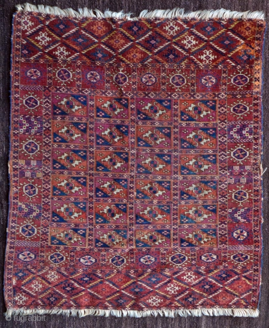 Late 19th century small tekke turkmen rug, possibly a dowry trapping. Great colours – evenly low pile with several small areas of crude repairs and a larger section in the upper selvedge  ...