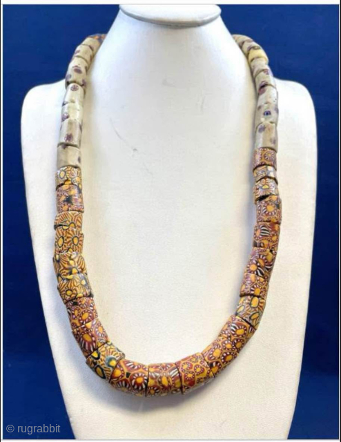 Millefiori African Trade Beads Necklace. Intricately designed mosaic-pattern glass beaded necklace with vibrant patterns. Age circa 1900.  Nearly 50 beads make up this necklace! 

These mosaic glass beads were used as  ...