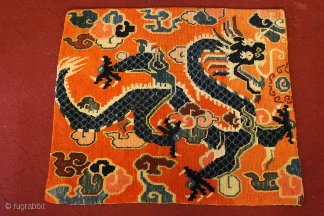 circa 1925 ,Small sitting or meditation Rug with Dragon holding precious jewels in orange background.
Good Condition and no repair.
feel free to ask more about it.        