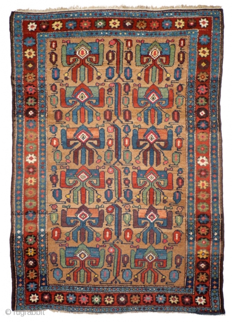 902 Rare Kurdish village rug with a never before seen design, 125/181 cm, Northwest Persia, 19th century, good condition, fantastic natural colours on a camel hair field, no comparable piece known!
For more  ...