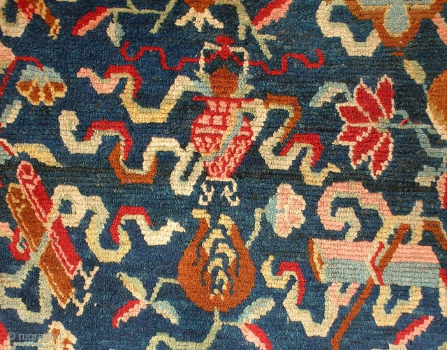 Jabuye, Tibet, late 19th century, cm 77x60. This pillow rug (jabuye) is quite an interesting one, for its overall design is a merry riot of motifs. This relates to the fact that  ...