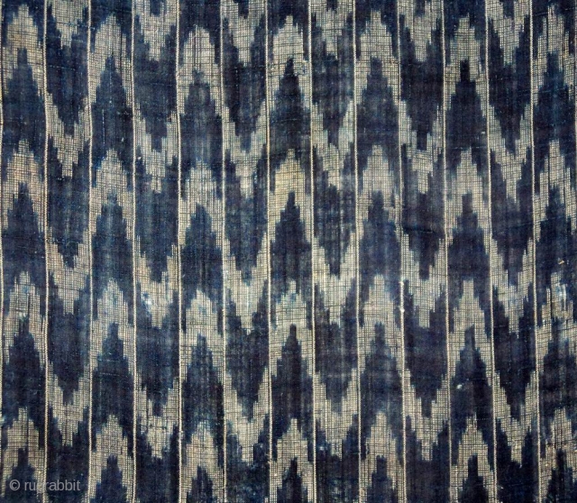 Kasuri cotton ‘flaming’ panel, Japan, Meiji (circa 1880), cm 99x33. ‘kasuri’ is the Japanese term for what is commonly knows as ikat weaving. The kasuri process involves yarns being tied before they  ...