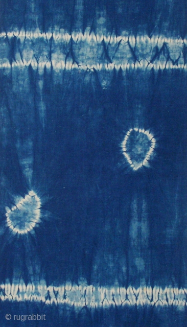 Indigo shibori panel, Japan, Taisho (c.1920), 165x33cm. The common English translation of the Japanese word shibori is "tie-dye"; however, a more accurate translation is "shaped-resist dyeing," which describes the inherent patterning process  ...