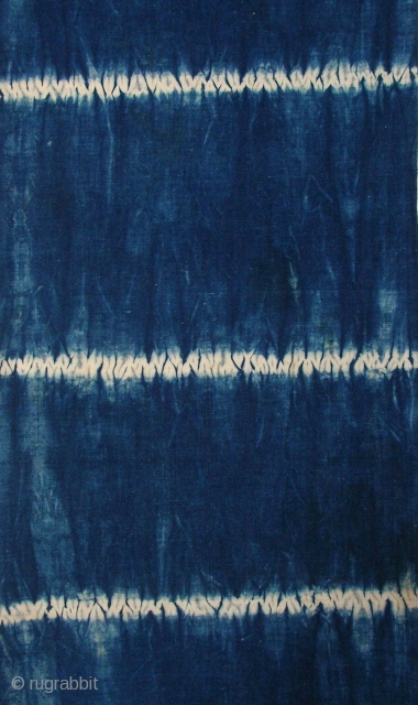 Indigo shibori panel, Japan, Taisho (c.1920), 151x33cm. The common English translation of the Japanese word shibori is "tie-dye"; however, a more accurate translation is "shaped-resist dyeing," which describes the inherent patterning process  ...