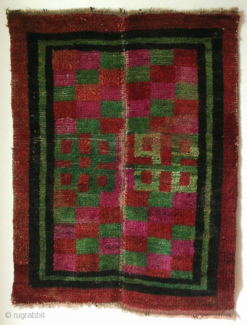 Mat, Tibet, early 20th century, cm 70x55. Tibetan rugs in so-called ‘tsuk-truk’ technique (woven in narrow stripes - then joined - on small back strap looms) are probably the survivors of a  ...