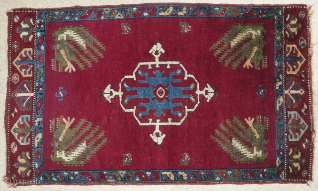 Antique late 19th century / early 20th century Kirshehir yastik rug. Beautiful colors with a cochineal field and purple accents. All colors are probably natural. Woven with an average knot count of  ...