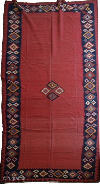 Kilim rug.  #1073
Origin: Western Iran. 
Size:7'X15'
Age: Early 20th c. 
Wool.  
Dovetailed tapestry weave. Reversible. 
Condition: Very good. 
This elegant kilim was probably woven for the hospitality tent of a khan  ...