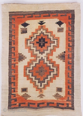 Navajo Rug

Origin: Southwest USA 
Size: 3'10"X5'4" 
Age: c. 1905 
Wool. Tapestry Weave 
Condition: very good.

The two stacked diamond medallions and the other symbols in the field are typical Navajo design elements; the  ...