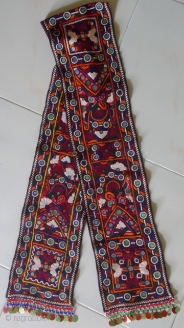This tribal embroidered piece is called Bokani (Muffler). It is pakka hand embroidered piece with beautiful mirror-works. It was made in desert Tharparkar, Pakistan. Its size is 60"X7". The wonderful fair work. 