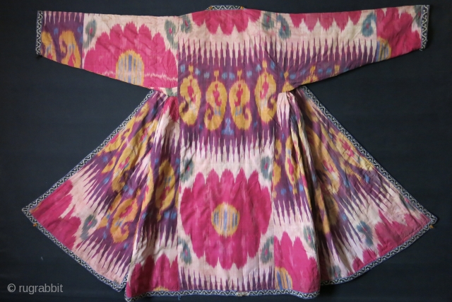 Uzbekistan Shoi - silk/ on silk quilted Chapan. Adras ikat facing and Printed cotton lining. very small minor holes in several places. Circa 1900 - size: Arm to arm 66" - 168  ...