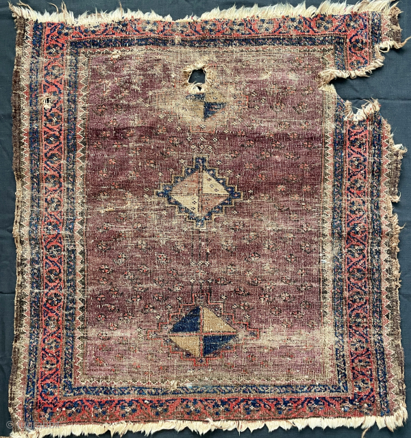 An antique beluch rug with a rare design. Size 95 x 84 cm