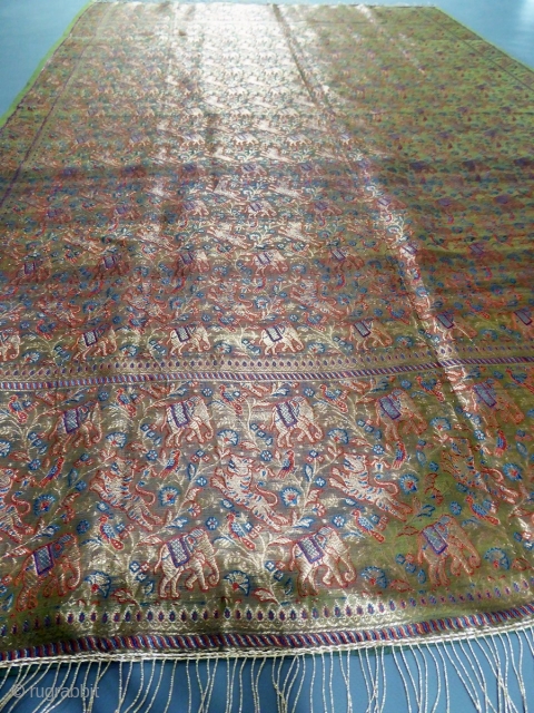 Before 1950
India for the domestic market 
Superb long silk woven shawl made in India for the domestic market probably around 1920/1930. Shawl with a background full of decorations of elephant and tiger  ...