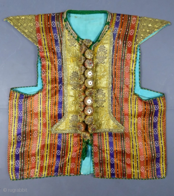 Circa 1900/1950
Tunisia
Beautiful wedding ceremony jacket from the Hammamet or Rafraf region in Tunisia. Back is in satin silk and multicolored cotton (violet, orange and red with thin stripes). Dickey with braids of  ...