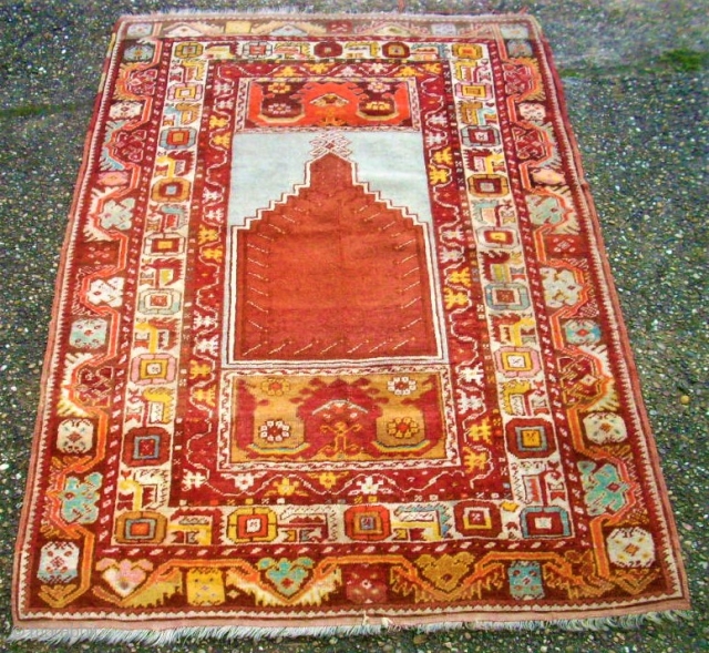 antique Kirshehir prayerrug. Size: 101 x 150 cm. Really good colors. One end is reknotted.                  