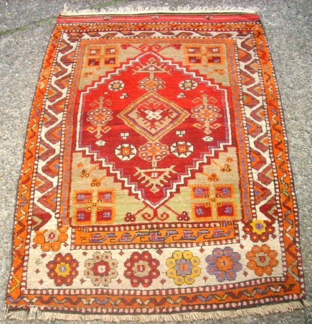 Old anatolian rug. Size: 89 x 124 cm. In good condition. I think that the one border is not re-notted, it is original.          