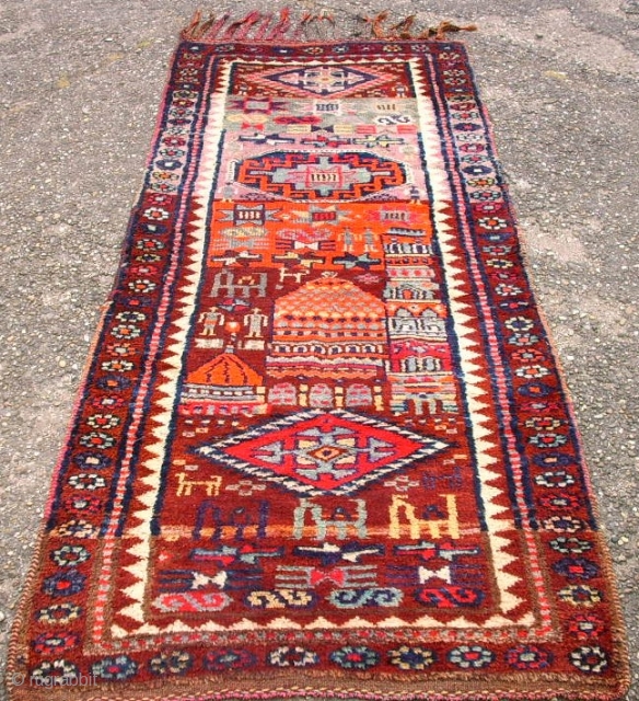 Very old happy kurdish rug. Size: 86 x 210 cm. Interesting rug. Some pile is low.                 