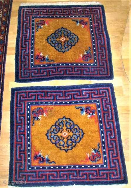 Pair of Tibetan / Chinese rugs. Size: 66 x 60 cm and 66 x 61 cm.                 