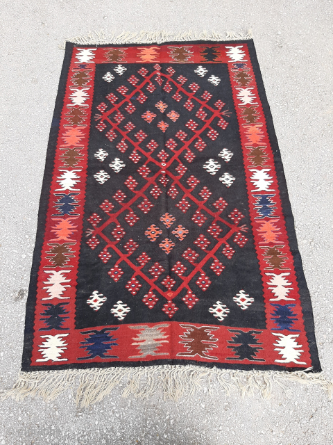 Antique Pirot Sarkoy kilim size approx
1.6 x 1m, on anunusual, black background. Ask for the price                 