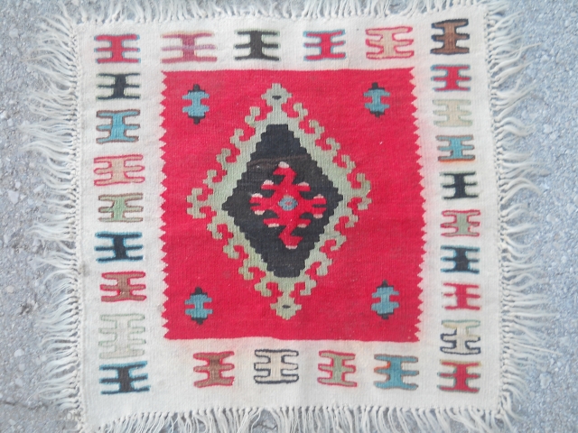 Small Sarkoy Pirot kilim.
Measuring about 45 x 45 cm.

Price- ask for

                      