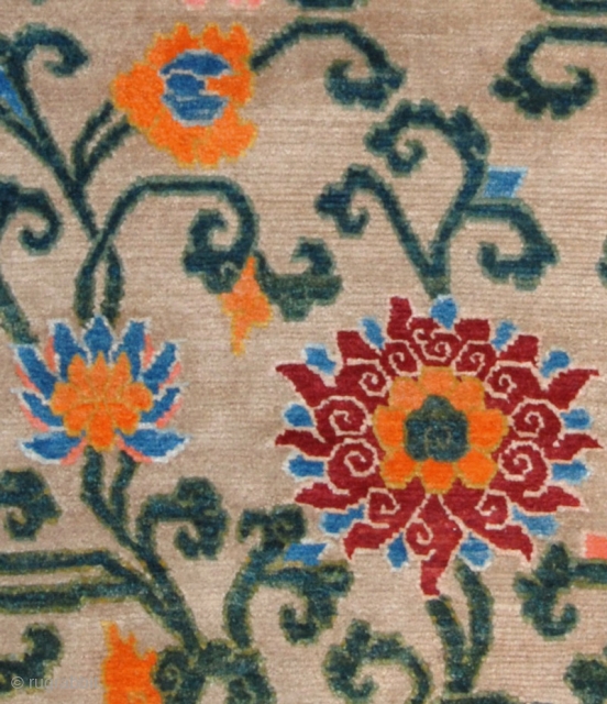 Beautiful Tibetan floral khaden (bed size rug) featuring two lotus’s - each growing out of Mount Meru, the mythical sacred mountain in Buddhist cosmology - with a bat ‘anchoring’ each of the  ...