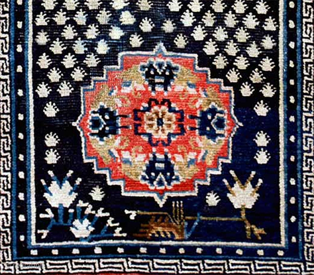 Three medallion Tibetan khaden with the belak (frogfoot / footprint of the frog) motif scattered throughout the center panel. The medallions have a floral center motif that is enclosed by a mandala  ...