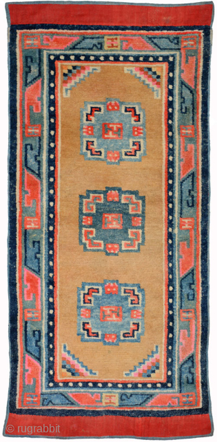 Lovely Tibetan khaden with three mandala-like medallions and uncommon abstract main border motifs. The pile is full throughout, the dyes are excellent and both the warp and weft (and pile) are of  ...