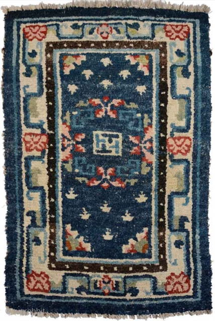 When this rug was first seen by me many many years ago it had a ragged outer blue covered felt border that showed signs of having been used as an 'above-saddle' carpet.  ...