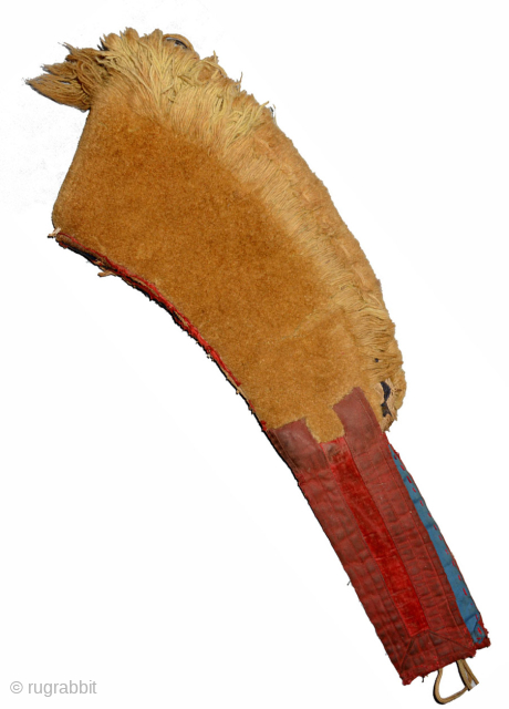 Crescent shaped pile-woven yellow Tibetan 'hat' which denotes monks of the Gelugpa sect, and worn during religious ceremonies. (The Dalai Lama, who holds the highest position in the Gelugpa sect, is considered  ...