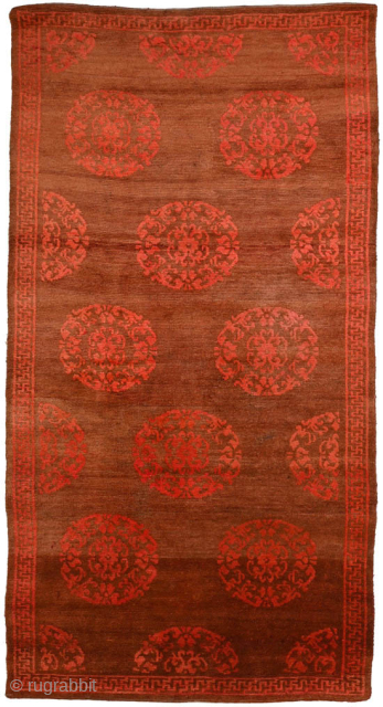 Tibetan khaden with a center field design made up of roundels and half roundels that is generally associated as mimicking Chinese silk brocade. It is quite heavily abashed throughout the main field,  ...