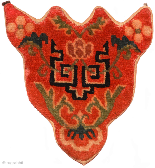 Tibetan takyeb (pack animal forehead ‘decoration’) with a geometric design and the green stems of several flowers interwoven lattice-like though it. Hand spun wool warp and weft and tightly woven (estimated +/-  ...