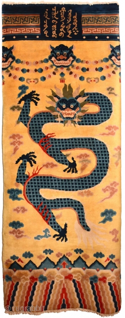 Unusual front-facing-dragon carpet made in either Ningxia or the Baotou-Suiyuan region of China and which is probably a remake of a much earlier Ningxia carpet that would have originally been made to  ...