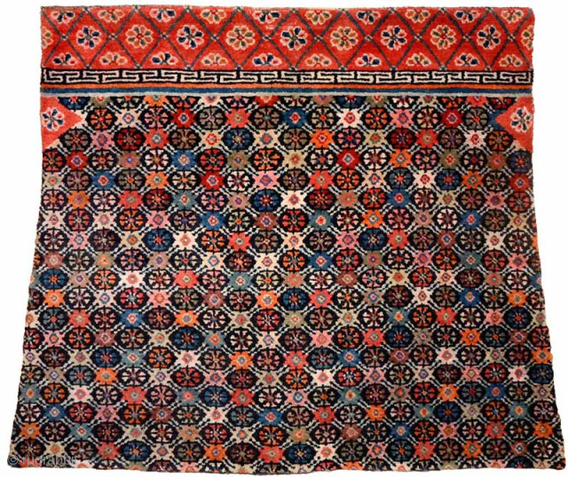 Sensational Tibetan takheb intended for use as a horse or yak cover / blanket, with an elaborate, visually stunning, multi-coloured flower-head design arranged in a lattice-like pattern throughout the main field. The  ...