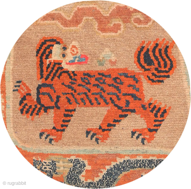 Powerful Tibetan 'butterfly' shaped makden, or under-saddle carpet, featuring a rare depiction of a tiger either side and six dragons chasing the elusive 'flaming jewel' in the border. Made in the early  ...