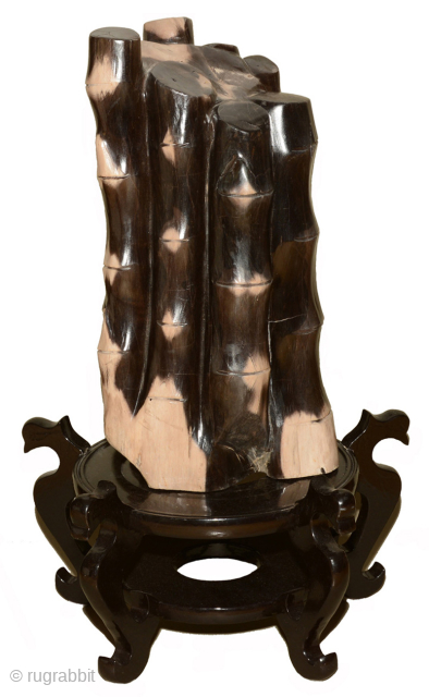 Solid block of fossilised wood carved to resemble bamboo stalks and stained to correspond to the look of a young clump of giant black bamboo (Phyllostachys Nigra Daikokuchiku). Japan, early 1900’s. Height  ...