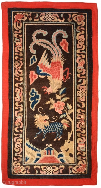 Rare and collectable Chinese carpet that came out of Tibet – hence the red cloth covered felt border so popular amongst Tibetans - but believed to have been made somewhere in Inner  ...