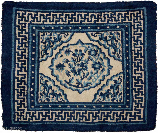 Tibetan khagangma, or seating carpet, made using various shades of indigo natural dye set against an off-white undyed wool background. Constructed circa the early 1900's, it is quite tightly woven (for a ...