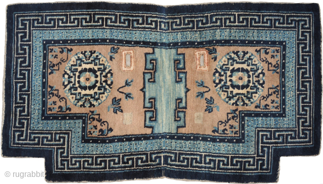 Tibetan under-saddle carpet (makden) made in the early 1900's with beautiful natural indigo blue dyes of varying shades and un-dyed wool. The 'Greek T' main border encases a secondary border with the ...