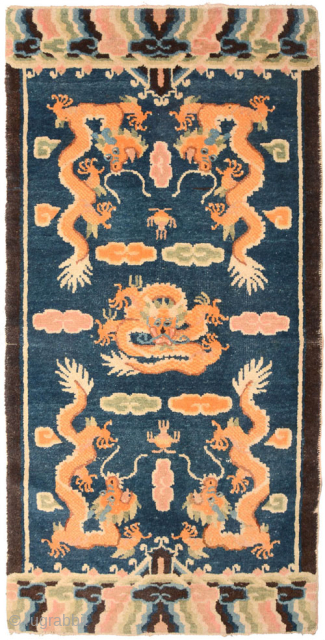 This five dragon carpet with a center field of naturally dyed lightly abrashed blue comes from either the Ningxia or Beijing region of China and was made in the latter part of ...
