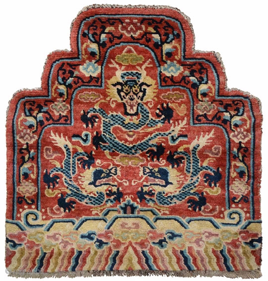 Tibetan Gyoyu or ‘throne back’. Tibetan lama’s throne back carpet featuring three five clawed dragons. The red colour could signify that it was used by a lama from one of the so-called  ...